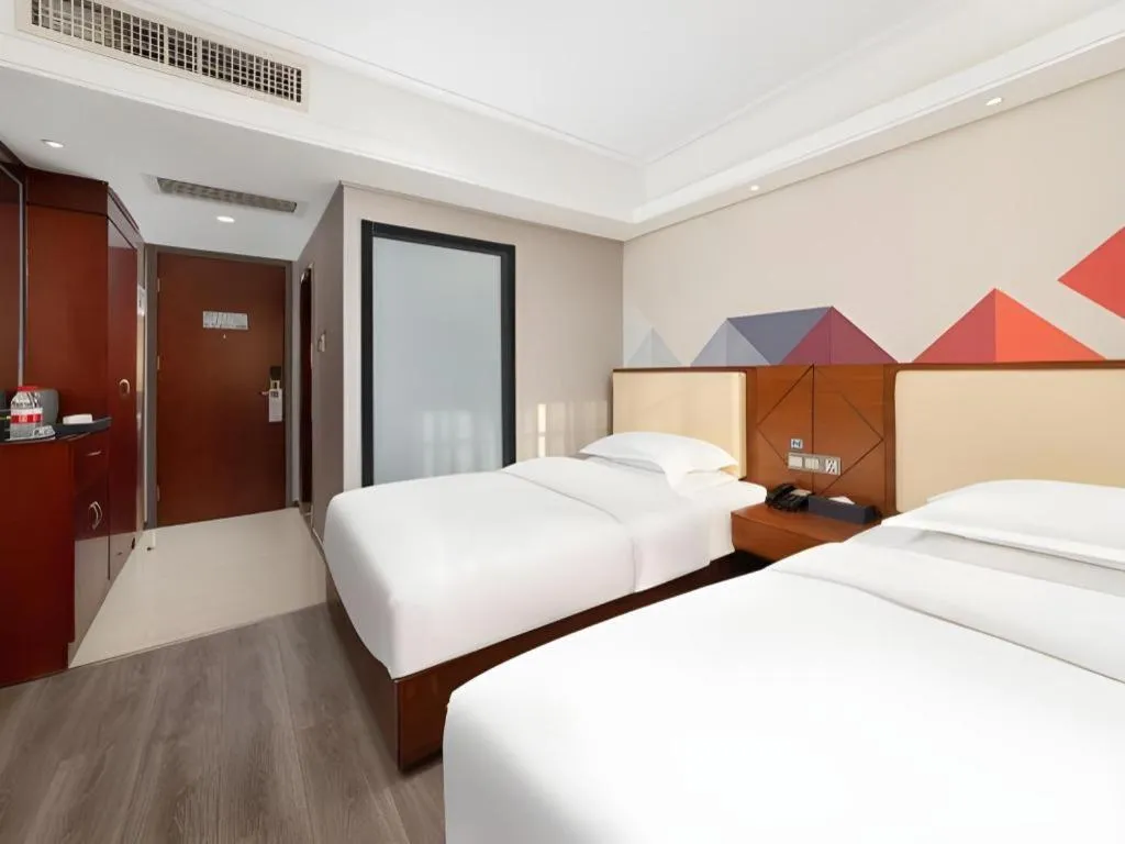 Bed in Borrman Hotel Guangzhou Railway Station Sanyuanli Metro Station