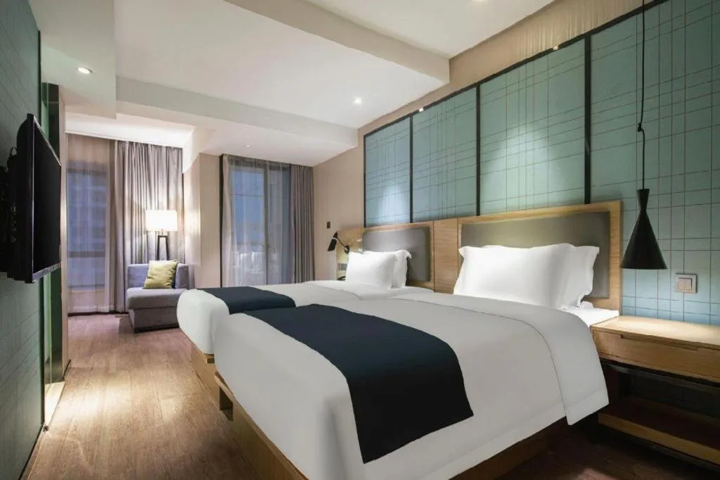Bed in Echarm Hotel Nanning the MixC Exhibition Center Metro Station