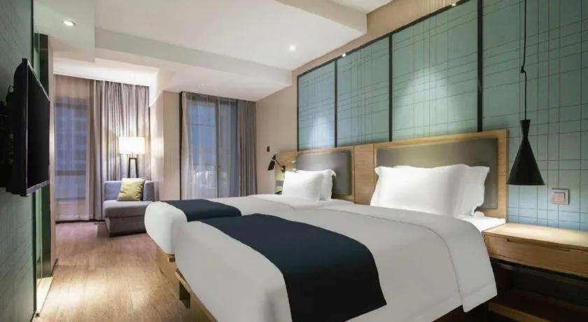 Bed in Echarm Hotel Nanning the MixC Exhibition Center Metro Station