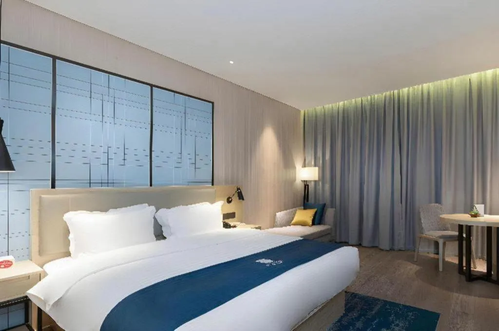 Bed in Echarm Hotel Nanning the MixC Exhibition Center Metro Station