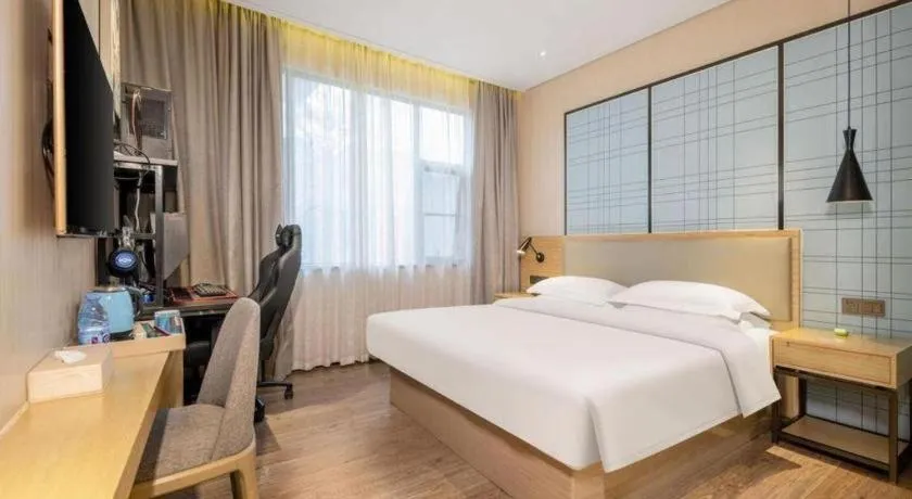 Bed in Echarm Hotel Nanning the MixC Exhibition Center Metro Station