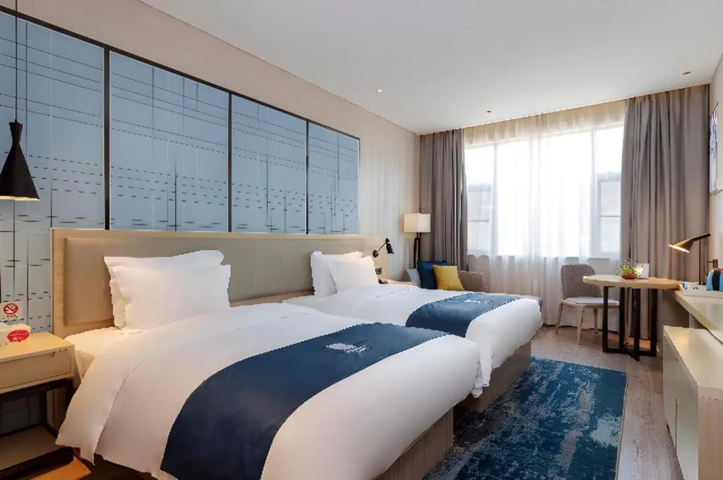 Bed in Echarm Hotel Nanning the MixC Exhibition Center Metro Station