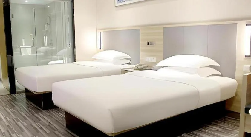 Bed in JTOUR Inn Yizhou Hechi College Pedestrian Street