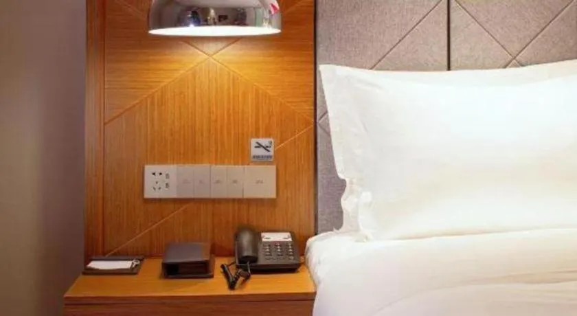 Bed in Borrman Hotel Zhanjiang Xuwen Port Terminal