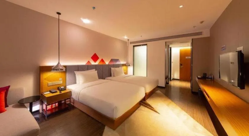 Bed in Borrman Hotel Zhanjiang Xuwen Port Terminal