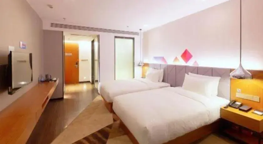 Bed in Borrman Hotel Zhanjiang Xuwen Port Terminal Bed in Borrman Hotel Zhanjiang Xuwen Port Terminal