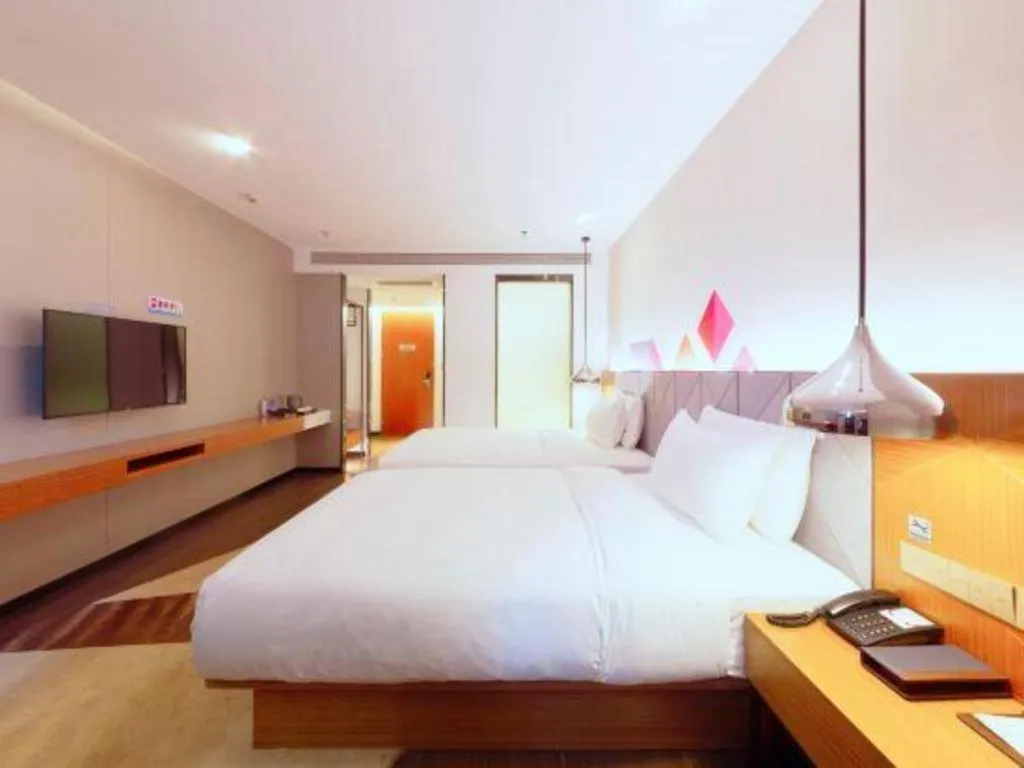 Bed in Borrman Hotel Zhanjiang Xuwen Port Terminal