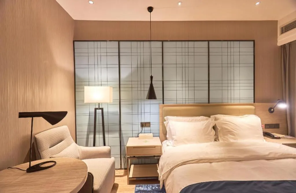 Bed in Echarm Hotel Liuzhou High-speed Railway Station