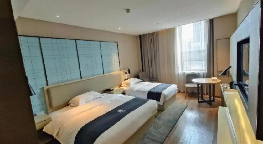 Bed in Echarm Hotel Liuzhou High-speed Railway Station