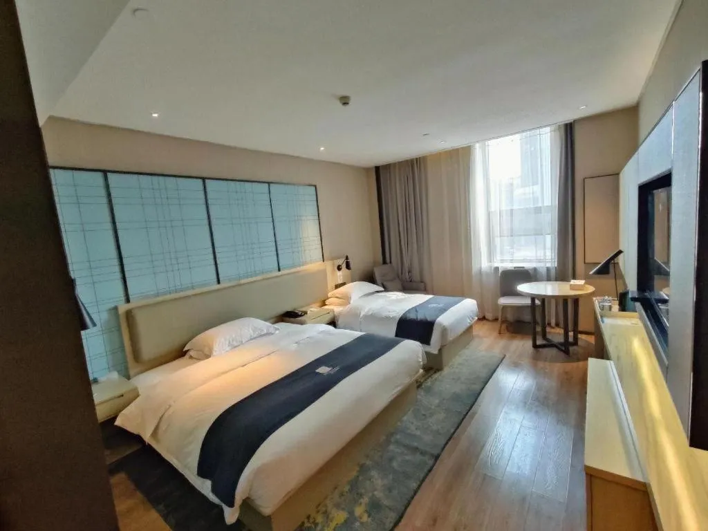 Bed in Echarm Hotel Liuzhou High-speed Railway Station