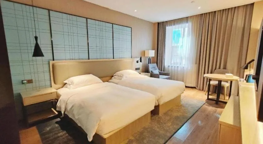 Bed in Echarm Hotel Liuzhou High-speed Railway Station
