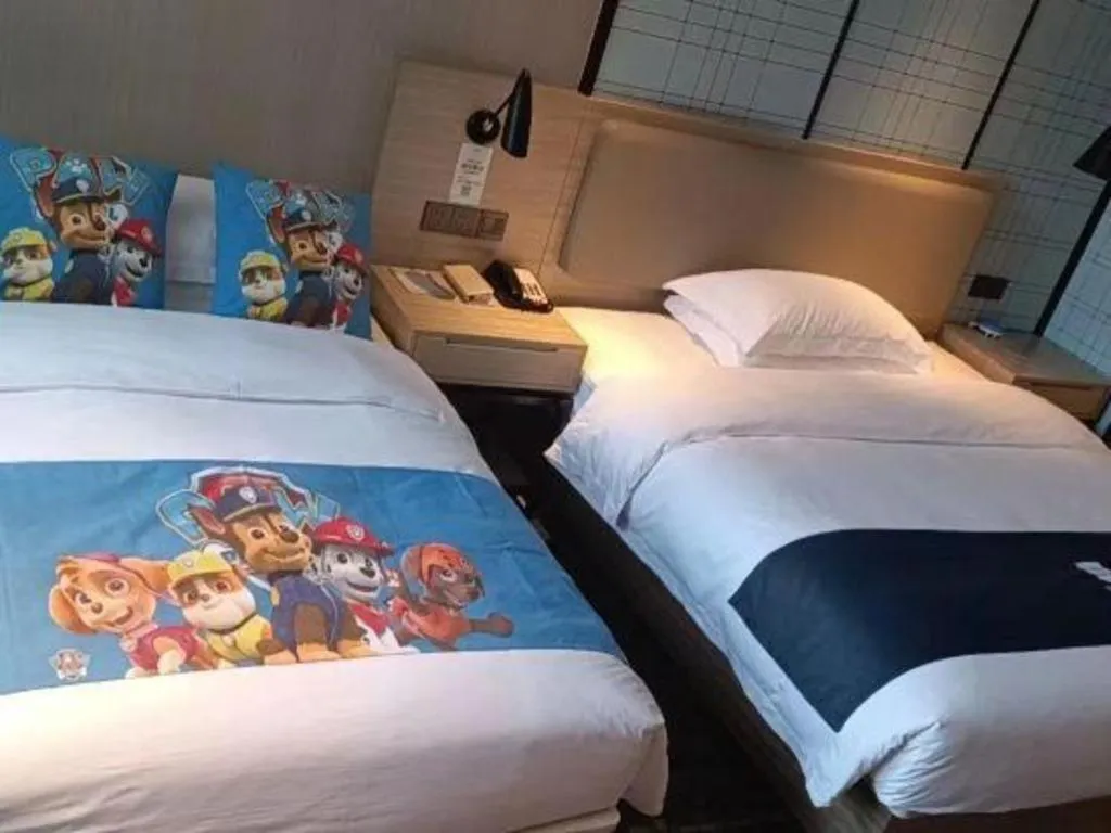 Bed in Echarm Hotel Liuzhou High-speed Railway Station