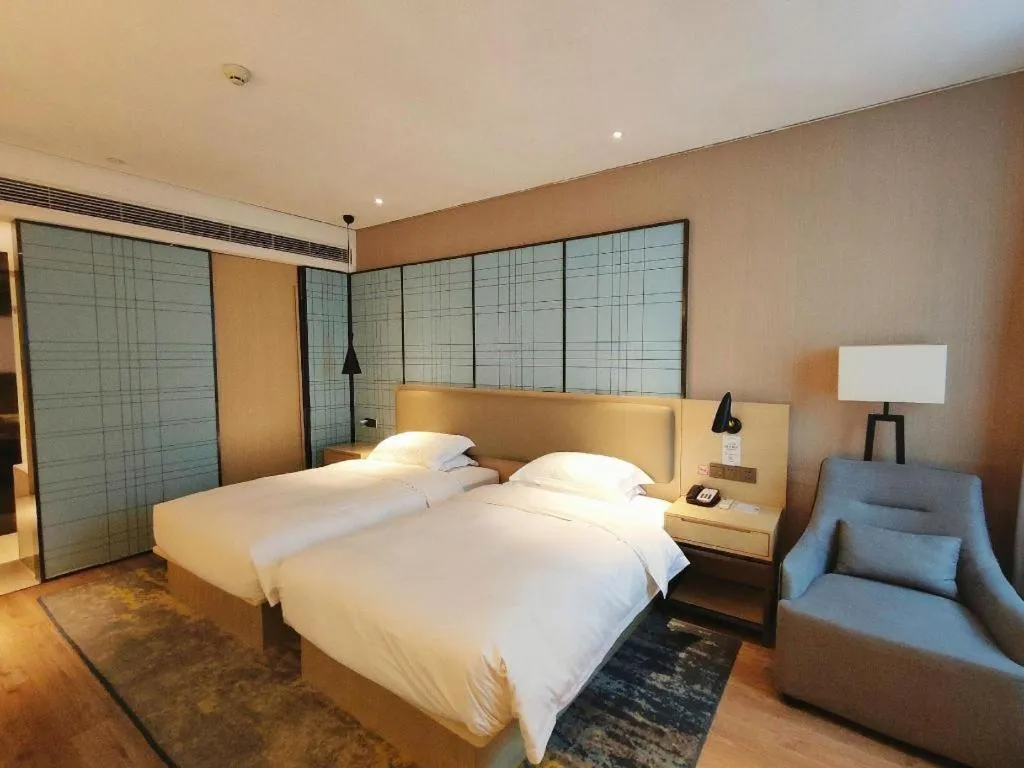 Bed in Echarm Hotel Liuzhou High-speed Railway Station