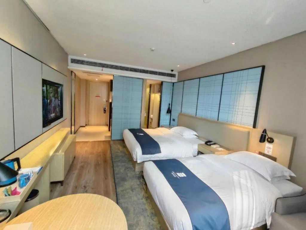Bed in Echarm Hotel Liuzhou High-speed Railway Station