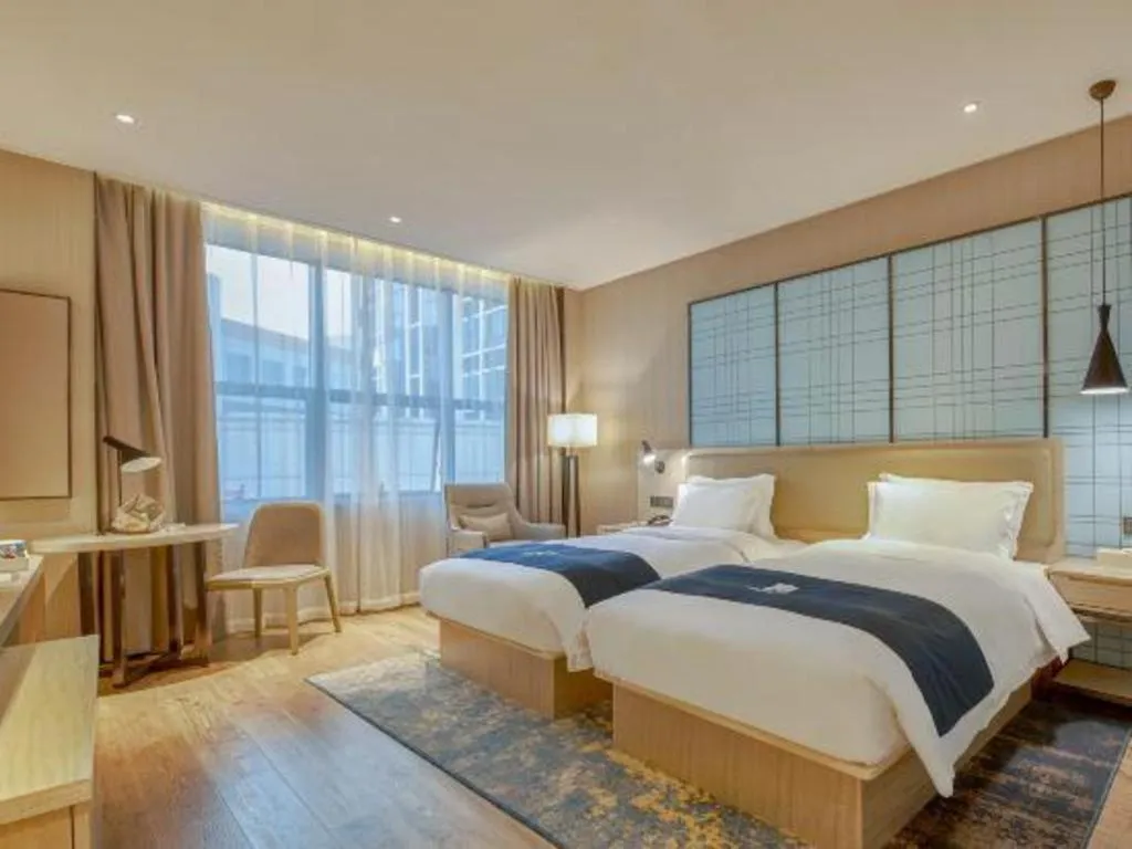 Bed in Echarm Hotel Liuzhou High-speed Railway Station