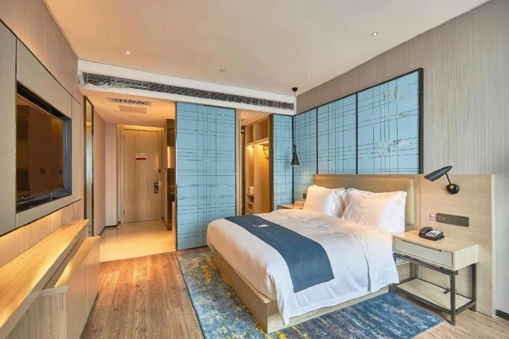 Bed in Echarm Hotel Liuzhou High-speed Railway Station