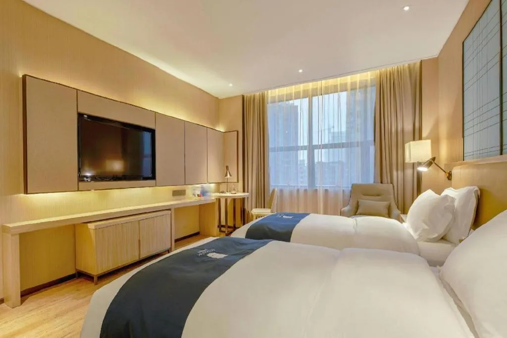 Bed in Echarm Hotel Liuzhou High-speed Railway Station