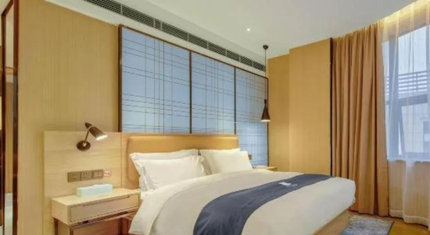Bed in Echarm Hotel Liuzhou High-speed Railway Station