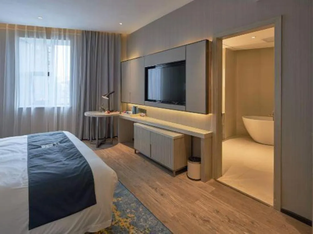 Bed in Echarm Hotel Liuzhou High-speed Railway Station