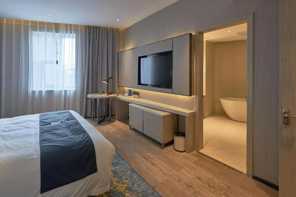 Bed in Echarm Hotel Liuzhou High-speed Railway Station