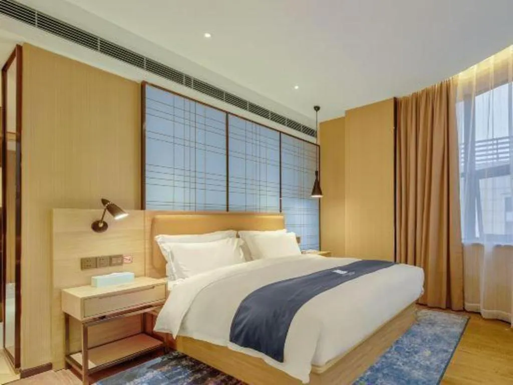 Bed in Echarm Hotel Liuzhou High-speed Railway Station