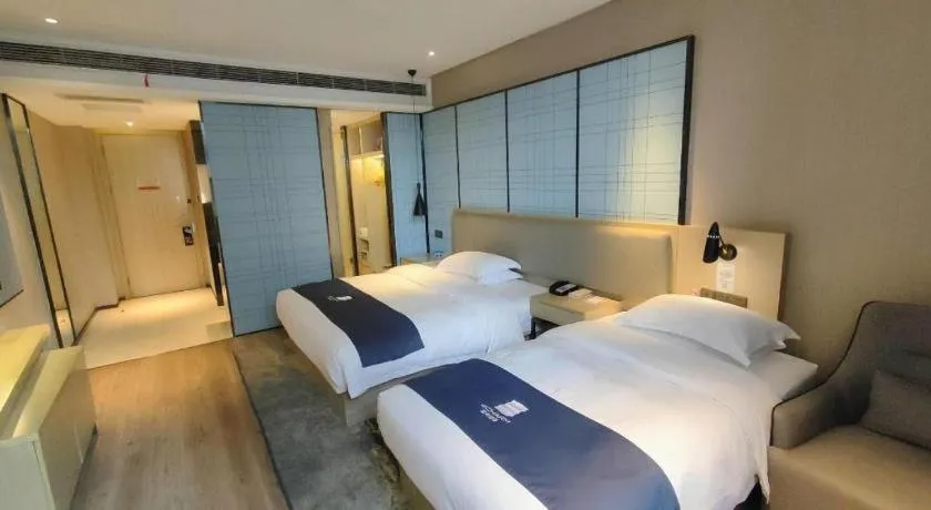Bed in Echarm Hotel Liuzhou High-speed Railway Station
