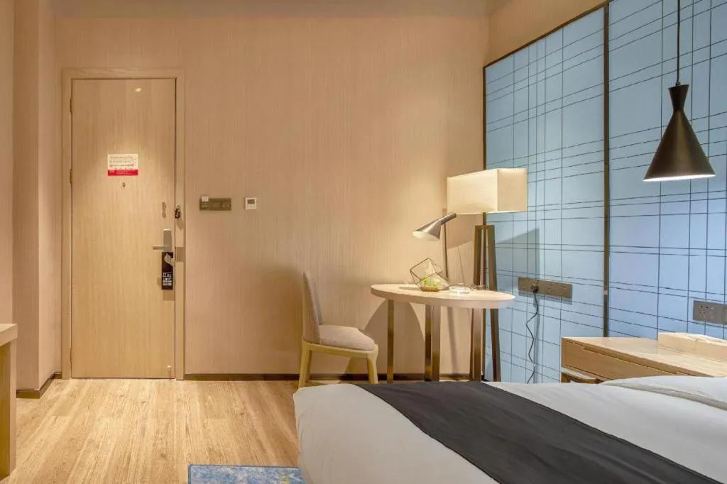 Bed in Echarm Hotel Liuzhou High-speed Railway Station