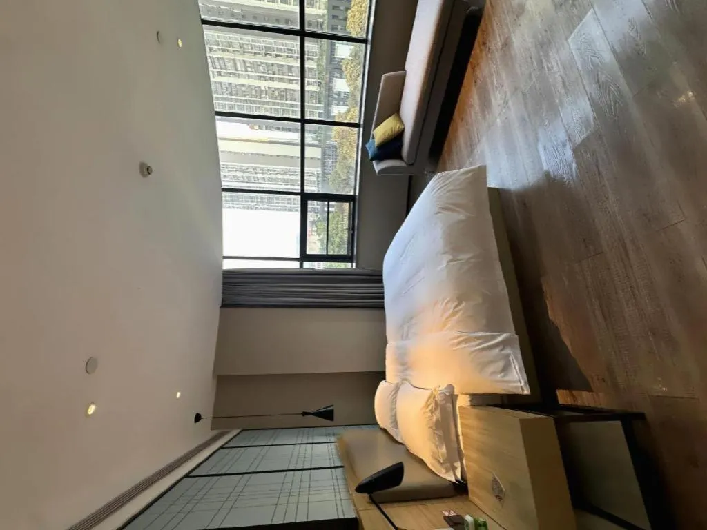 Bed in Echarm Hotel Liuzhou High-speed Railway Station