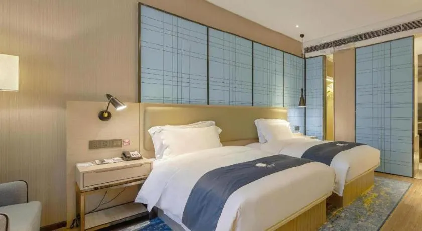 Bed in Echarm Hotel Liuzhou High-speed Railway Station