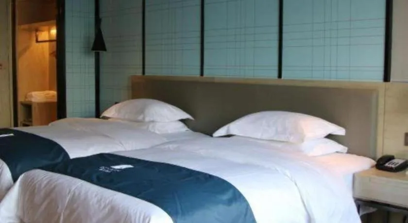 Bed in Echarm Hotel Nanning Qingxiu Mountain