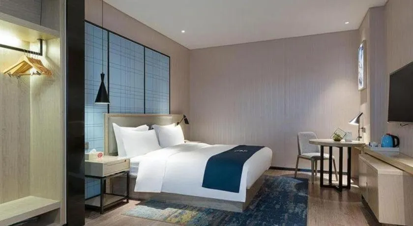 Bed in Echarm Hotel Nanning Qingxiu Mountain