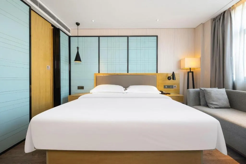 Bed in Echarm Hotel Nanning Qingxiu Mountain
