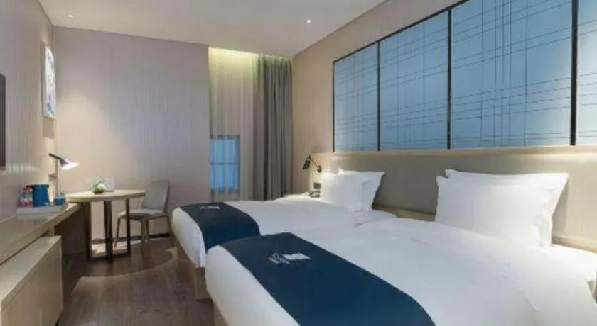 Bed in Echarm Hotel Nanning Qingxiu Mountain