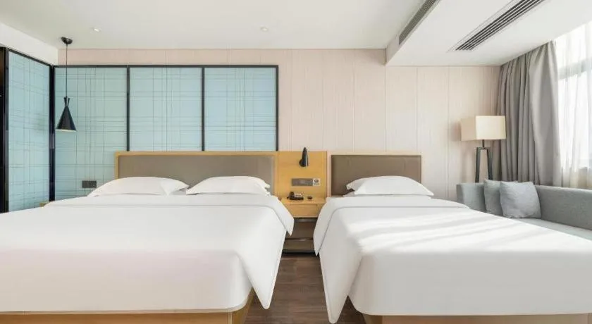 Bed in Echarm Hotel Nanning Qingxiu Mountain