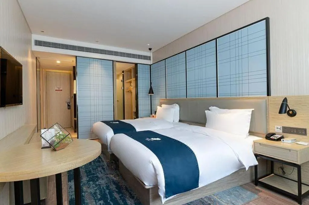 Bed in Echarm Hotel Nanning Qingxiu Mountain