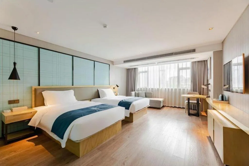 Bed in Echarm Hotel Nanning Qingxiu Mountain