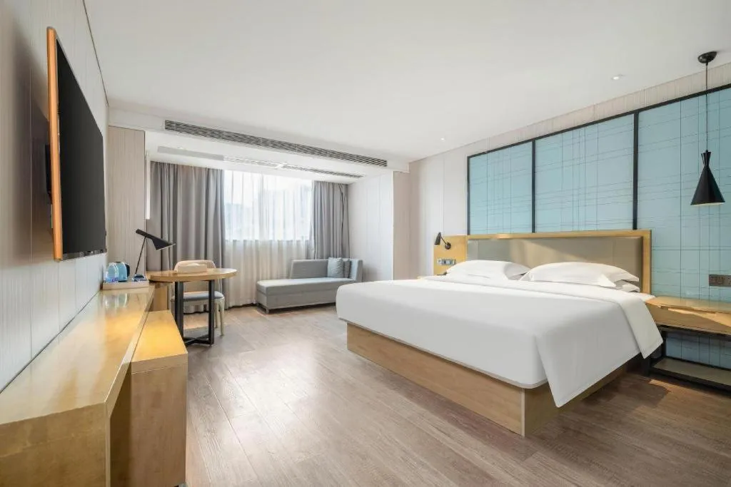 Bed in Echarm Hotel Nanning Qingxiu Mountain