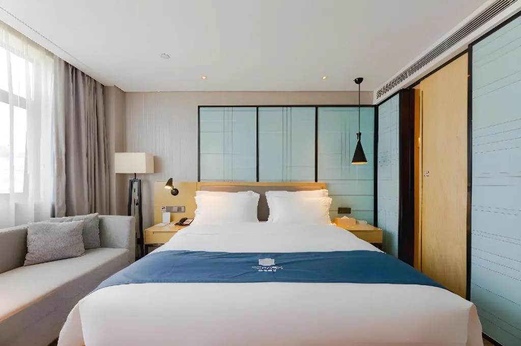 Bed in Echarm Hotel Nanning Qingxiu Mountain