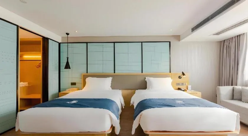 Bed in Echarm Hotel Nanning Qingxiu Mountain