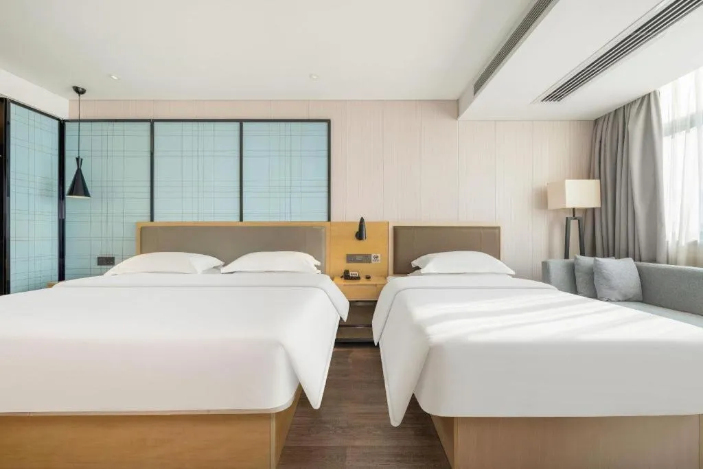 Bed in Echarm Hotel Nanning Qingxiu Mountain