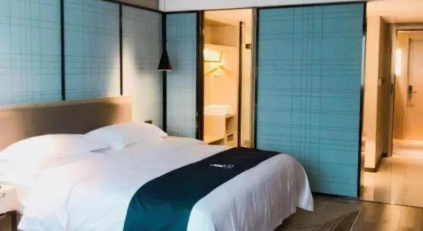 Bed in Echarm Hotel Nanning Qingxiu Mountain