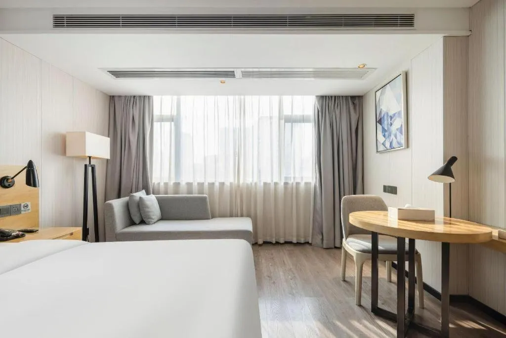 Bed in Echarm Hotel Nanning Qingxiu Mountain