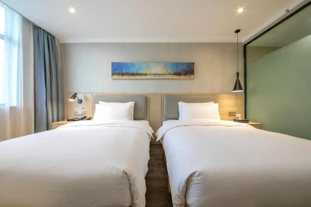 Bed in Borrman Hotel Wuhan Yangluo Metro Station Shenshuigang