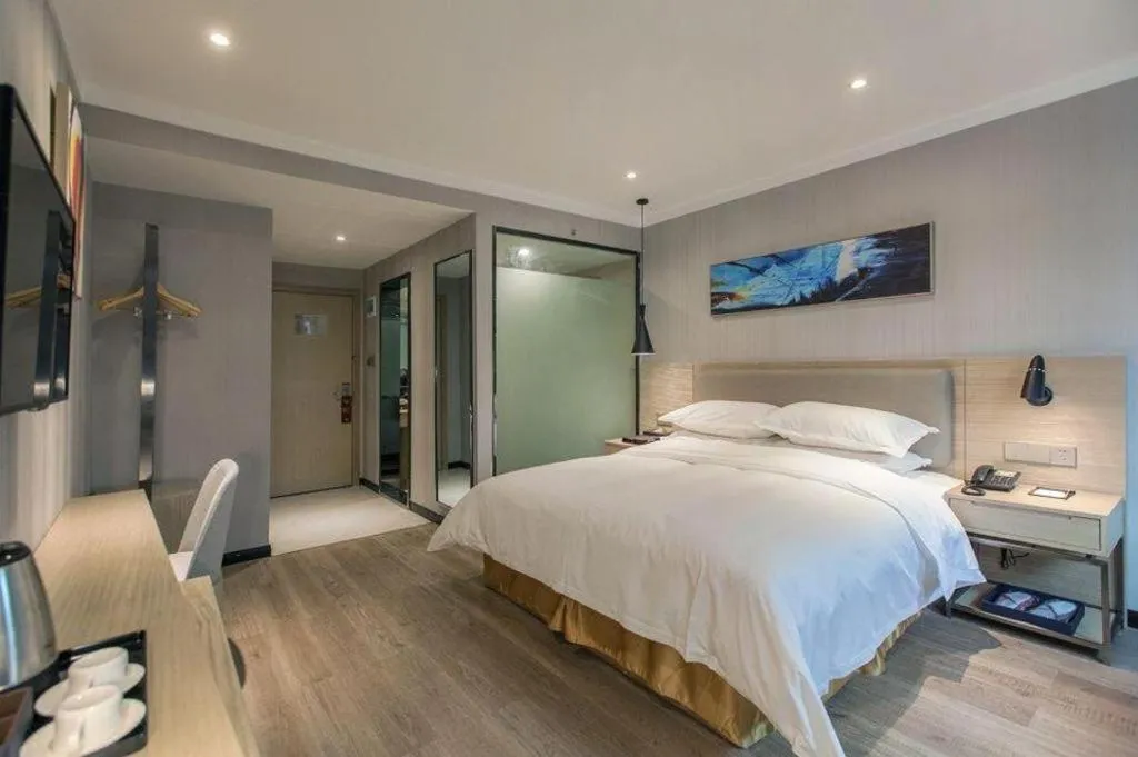 Bed in Borrman Hotel Wuhan Yangluo Metro Station Shenshuigang