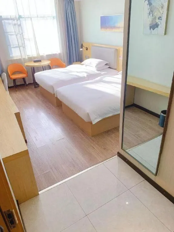 Bed in Borrman Hotel Wuhan Yangluo Metro Station Shenshuigang