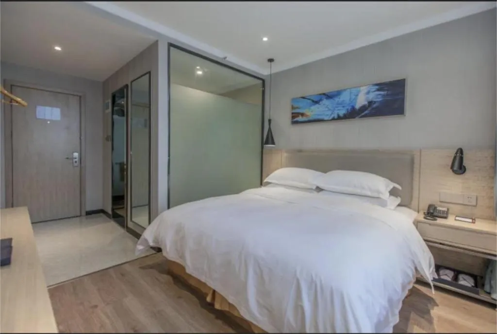 Bed in Borrman Hotel Wuhan Yangluo Metro Station Shenshuigang