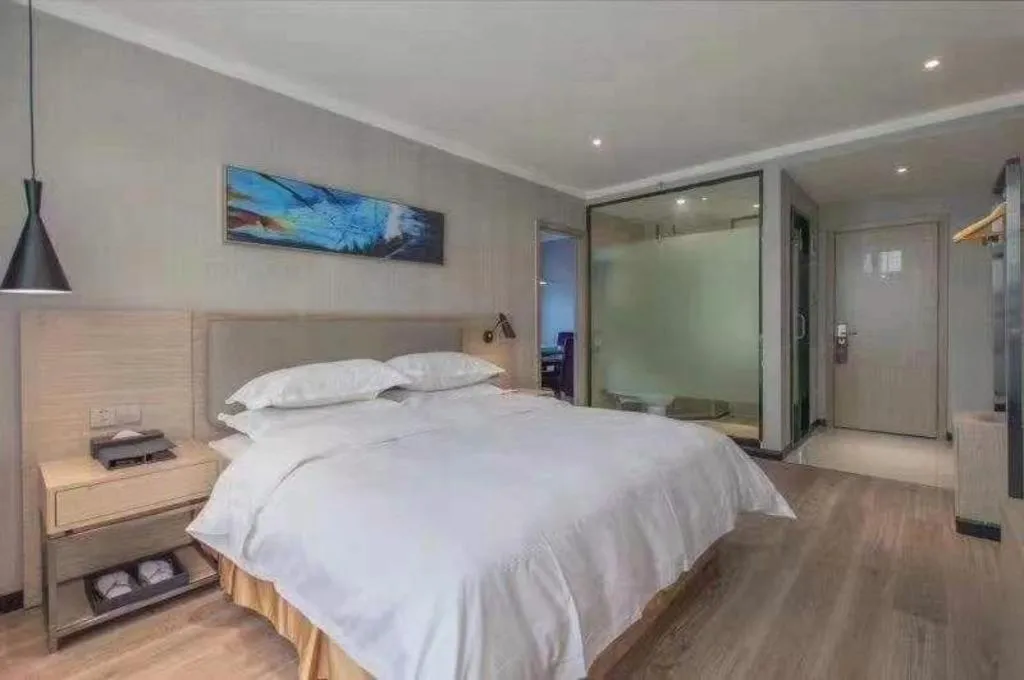 Bed in Borrman Hotel Wuhan Yangluo Metro Station Shenshuigang