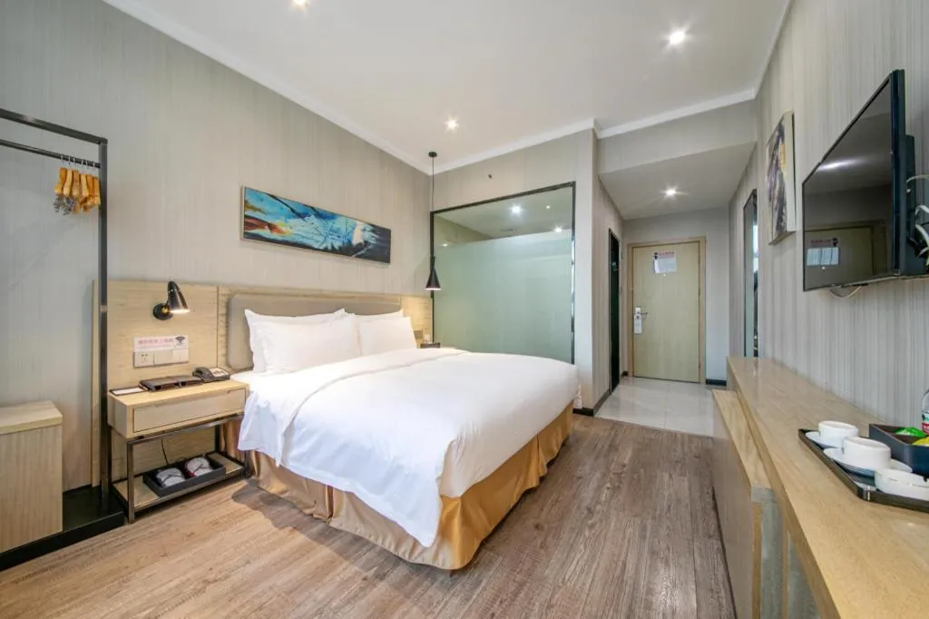 Bed in Borrman Hotel Wuhan Yangluo Metro Station Shenshuigang