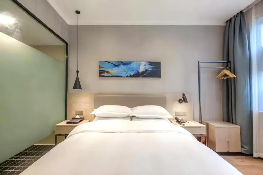 Bed in Borrman Hotel Wuhan Yangluo Metro Station Shenshuigang