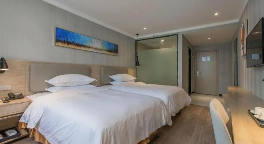 Bed in Borrman Hotel Wuhan Yangluo Metro Station Shenshuigang